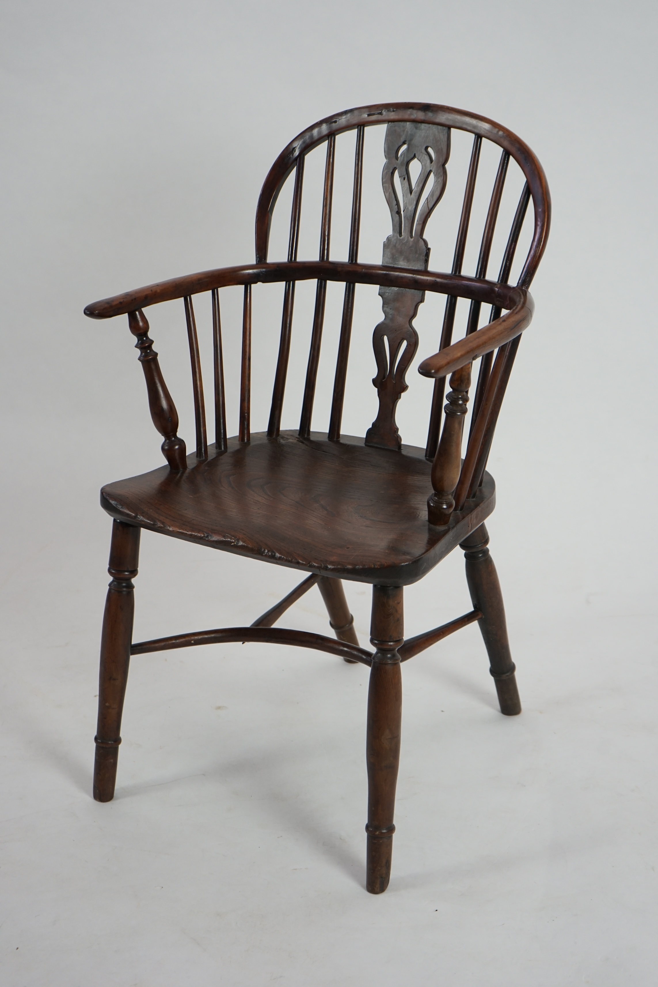 A mid 19th century yew, elm and ash Windsor chair